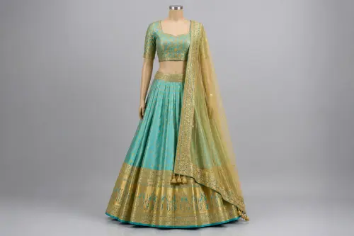 Turquoise Zari Temple Lehenga – Aqua Silk Satin Lehenga with Gold Border | Custom Tailored